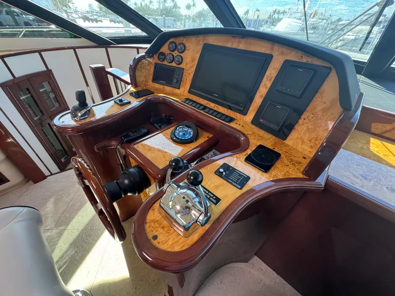 Slide: The Image of Luxurious helm of 2012 Neptunus 62 Flybridge yacht with advanced navigation controls. - 39