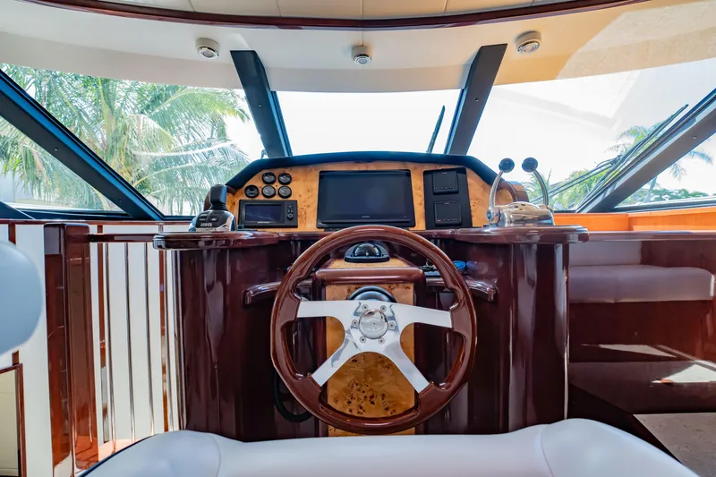 Slide: The Image of Luxurious helm of 2012 Neptunus 62 Flybridge yacht with polished wood finish. - 40