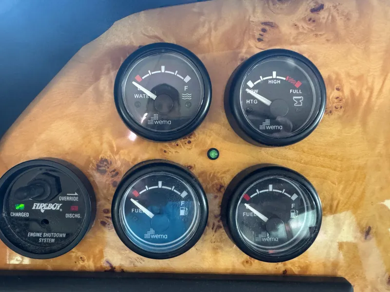 Slide: The Image of Control panel of a 2012 Neptunus 62 Flybridge with gauges and engine shutdown system. - 43