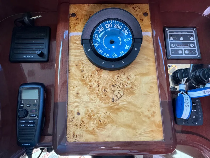 Slide: The Image of Control panel of a 2012 Neptunus 62 Flybridge with compass and Garmin device. - 48