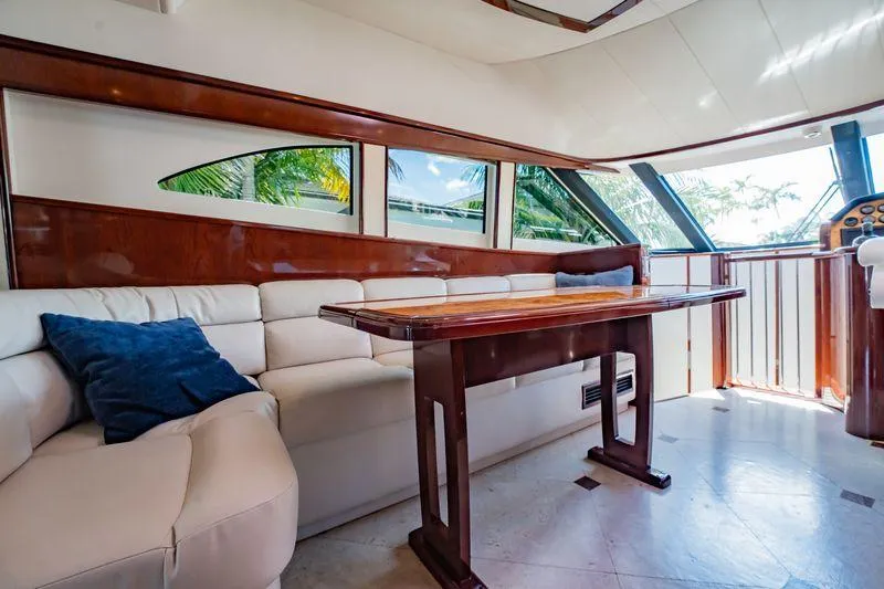 Slide: The Image of Luxurious interior of 2012 Neptunus 62 Flybridge yacht with elegant seating and table. - 52