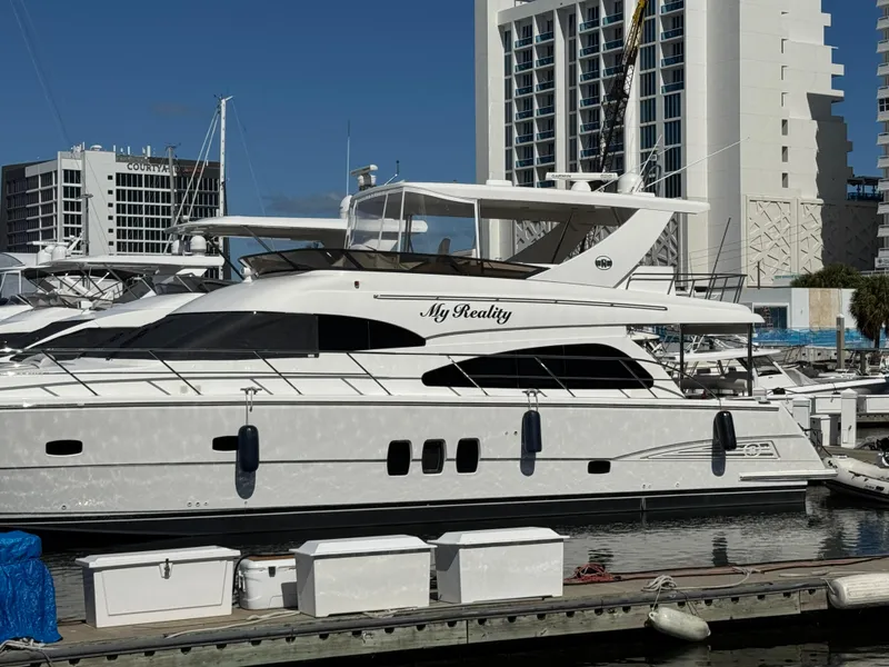 Slide: The Image of Luxury 2012 Neptunus 62 Flybridge yacht docked at marina, named "My Reality". - 6