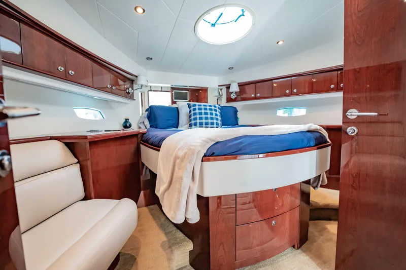Slide: The Image of Luxurious 2012 Neptunus 62 Flybridge yacht bedroom with elegant wood finishes. - 60