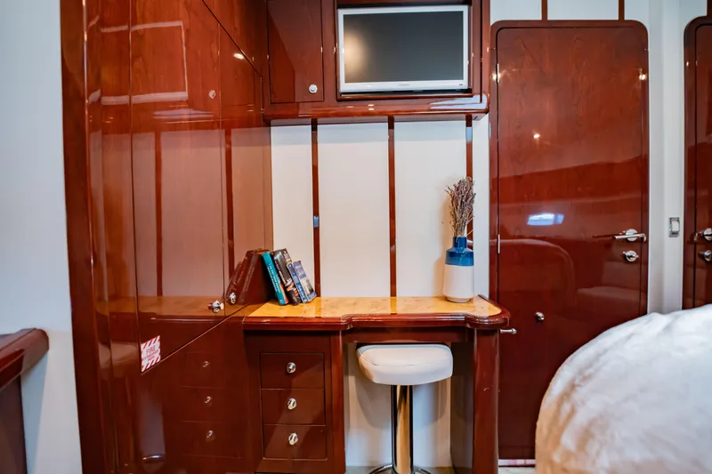 Slide: The Image of Luxurious Neptunus 62 Flybridge 2012 yacht interior with elegant wood finish and desk area. - 61