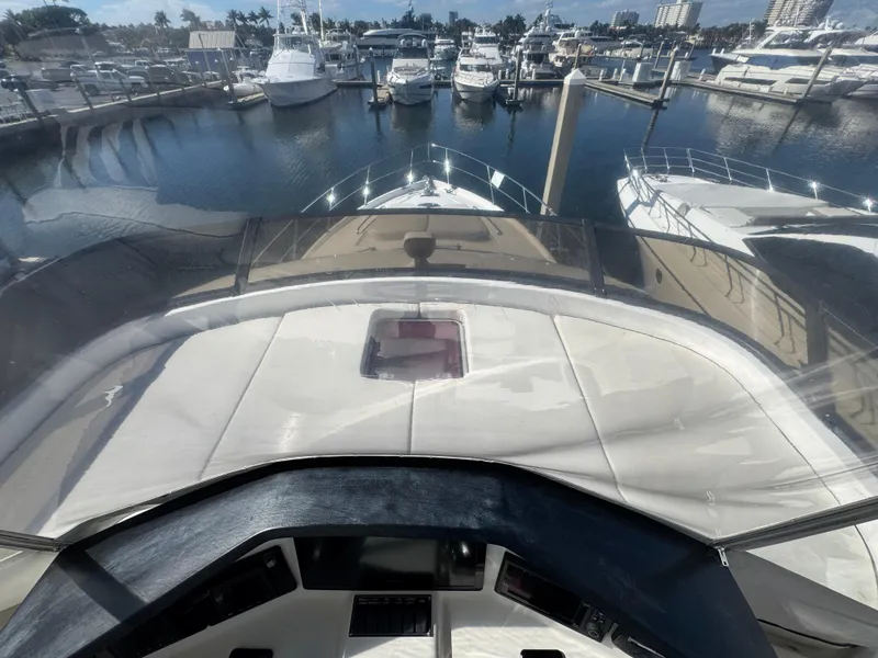 Slide: The Image of View from Neptunus 62 Flybridge yacht, 2012, overlooking marina with docked boats. - 68