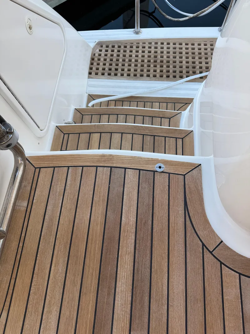 Slide: The Image of Wooden steps on a 2012 Neptunus 62 Flybridge yacht. - 70