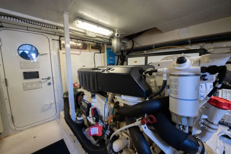 Slide: The Image of Engine room of 2012 Neptunus 62 Flybridge yacht, showcasing machinery and equipment. - 76
