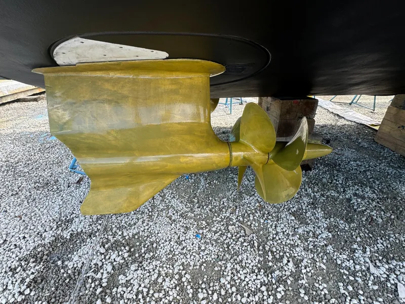 Slide: The Image of Propeller and rudder of 2012 Neptunus 62 Flybridge yacht on gravel. - 80