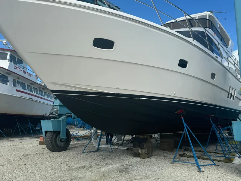 Slide: The Image of Neptunus 62 Flybridge 2012 yacht on dry dock, supported by stands. - 81