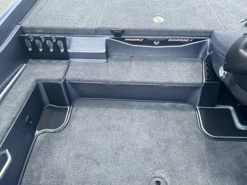 Slide: The Image of Interior of 2026 Phoenix 721 ZXL boat with carpeted flooring and storage compartments. - 10