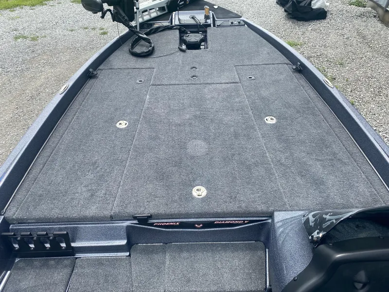 Slide: The Image of 2026 Phoenix 721 ZXL boat deck with gray carpeting and storage compartments. - 11