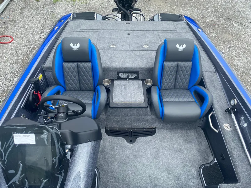 Slide: The Image of 2026 Phoenix 721 ZXL boat interior with blue and gray seats, steering wheel, and dashboard. - 17