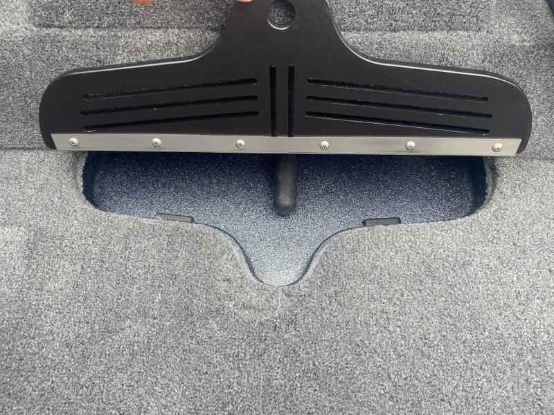 Slide: The Image of Carpeted storage compartment in a 2026 Phoenix 721 ZXL boat. - 18