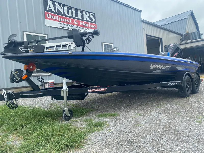 Slide: The Image of 2026 Phoenix 721 ZXL boat on trailer at Anglers Outpost & Marine dealership. - 3
