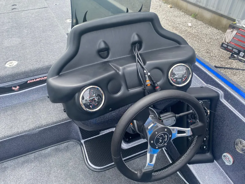 Slide: The Image of Dashboard of a 2026 Phoenix 721 ZXL boat with steering wheel and gauges. - 9