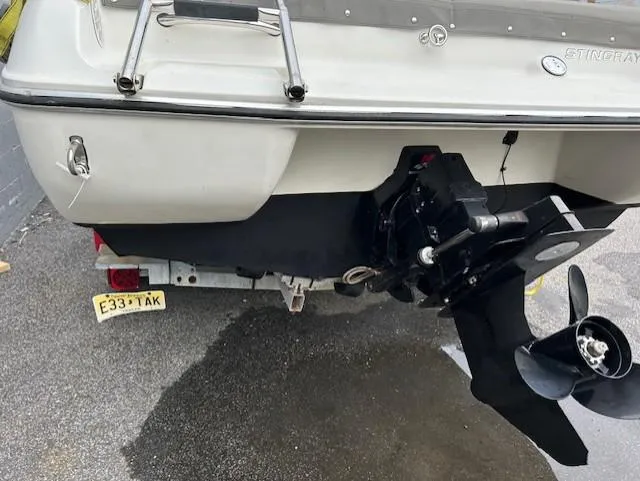 Slide: The Image of Rear view of a 2004 Stingray 190 CS/CX boat with visible propeller and license plate. - 3