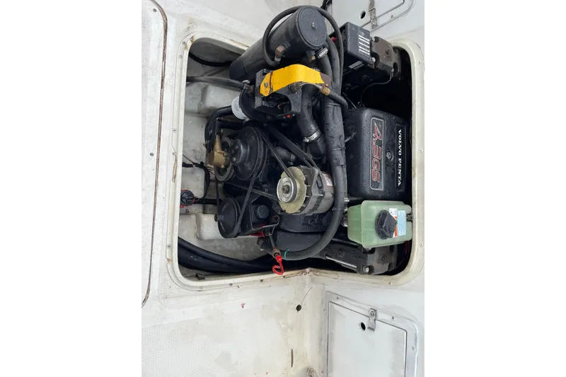 Slide: The Image of Engine compartment of a 1999 Sea Sport 2044 Walk Around boat, featuring a Volvo Penta 4.3GS. - 11