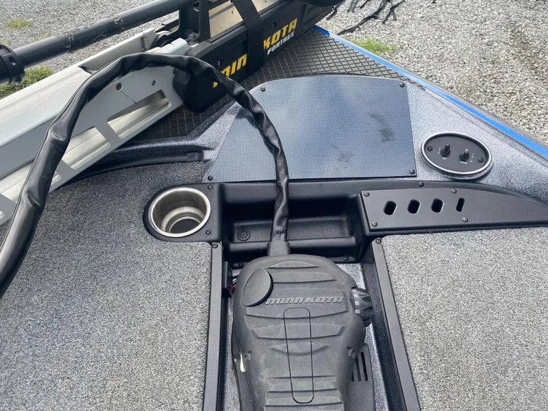Slide: The Image of 2017 Triton 179 TrX boat deck with Minn Kota trolling motor and control panel. - 13