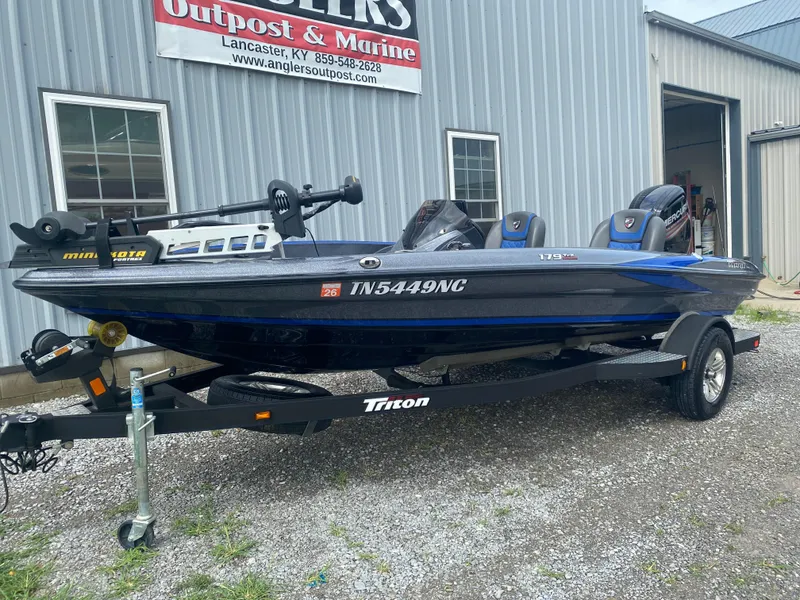 Slide: The Image of 2017 Triton 179 TrX boat on trailer outside Anglers Outpost & Marine. - 3