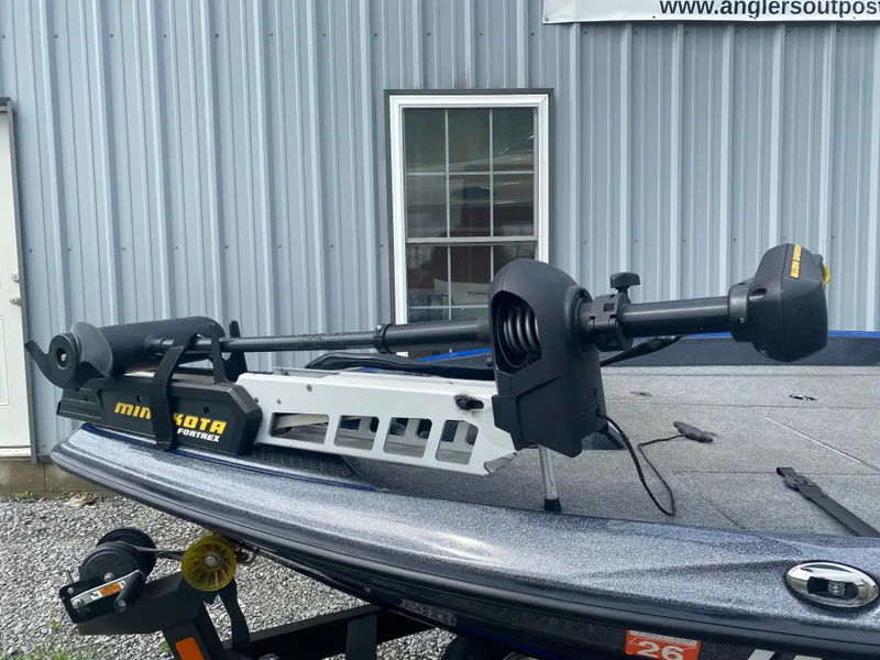 Slide: The Image of 2017 Triton 179 TrX boat with Minn Kota Fortrex trolling motor, parked outside a building. - 5