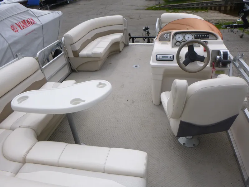 Slide: The Image of 2007 Smoker Craft M-8520 Cruise RE pontoon boat interior with seating and steering console. - 6