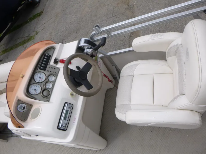 Slide: The Image of 2007 Smoker Craft M-8520 Cruise RE boat dashboard and captain's chair. - 7