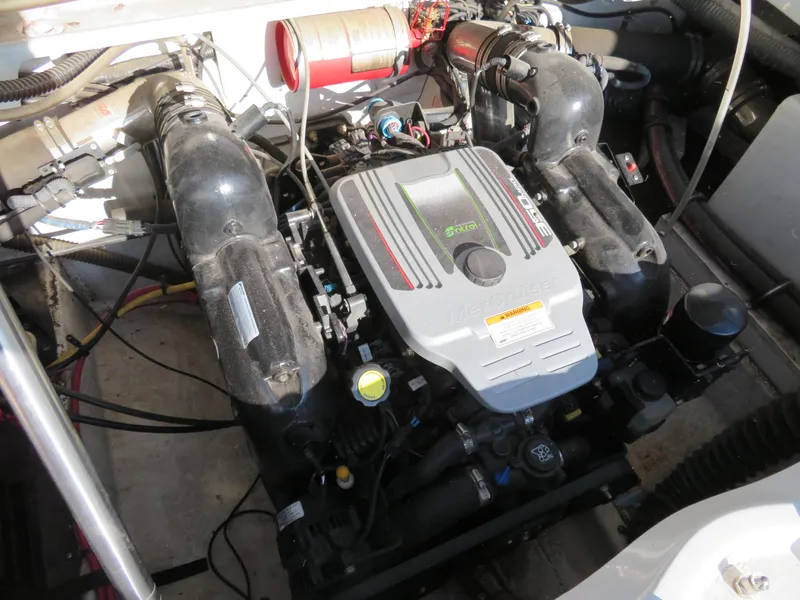 Slide: The Image of Engine compartment of a 2012 Crownline 275 SS boat, featuring a MerCruiser engine. - 11