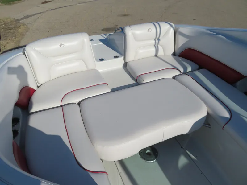 Slide: The Image of 2012 Crownline 275 SS boat interior with white and red cushioned seating. - 17