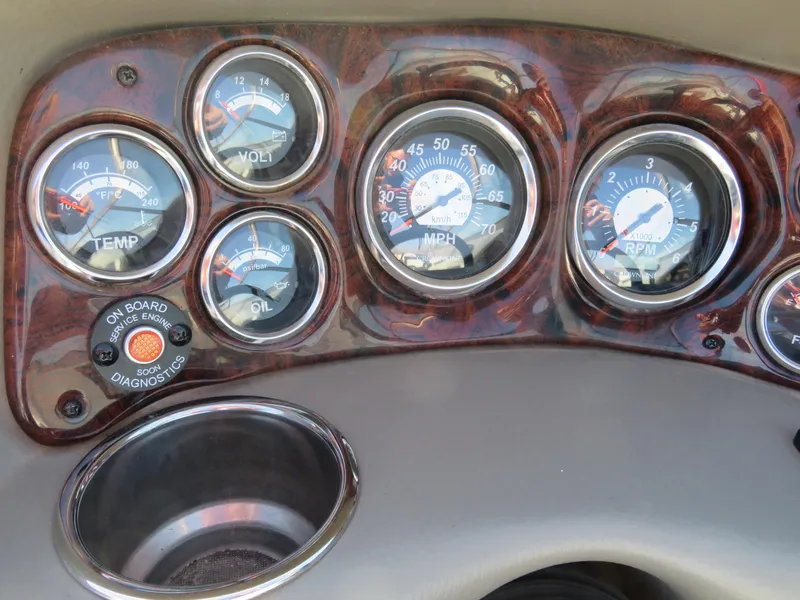 Slide: The Image of Dashboard of 2012 Crownline 275 SS boat with gauges and diagnostic panel. - 26