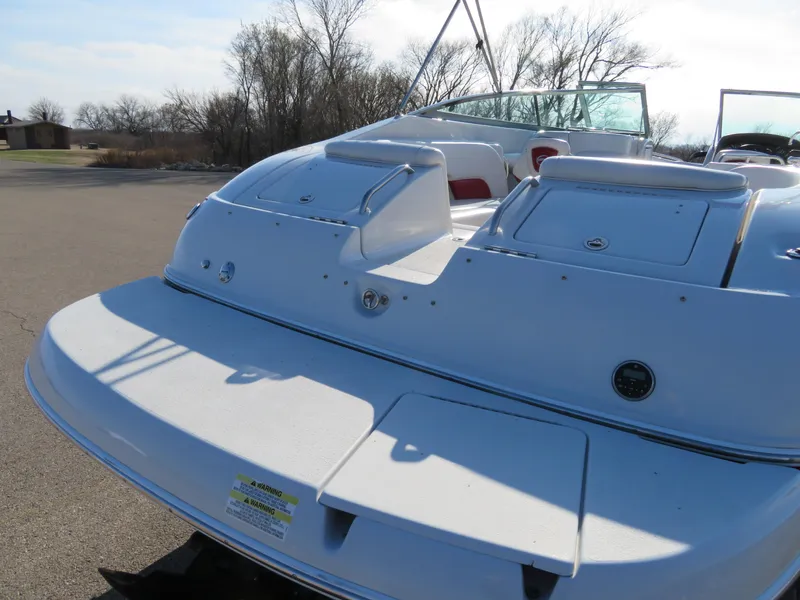 Slide: The Image of 2012 Crownline 275 SS boat rear view with swim platform and seating. - 5