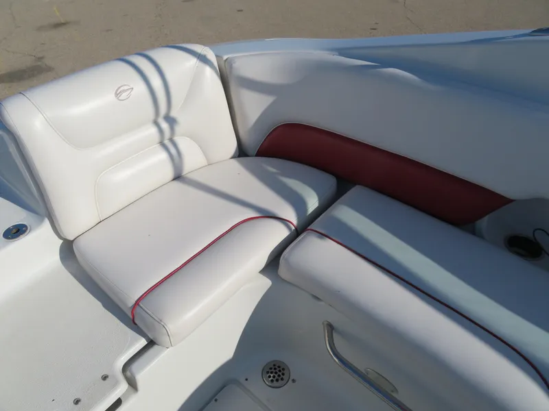 Slide: The Image of 2012 Crownline 275 SS boat interior with white and red cushioned seating. - 9