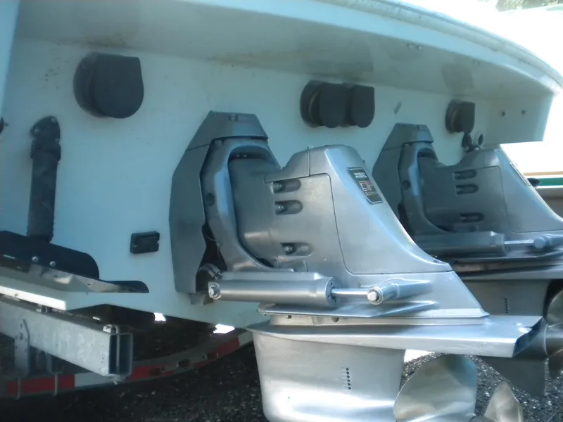 Slide: The Image of 2002 Formula 330 SS boat stern with dual outboard motors and propellers. - 27