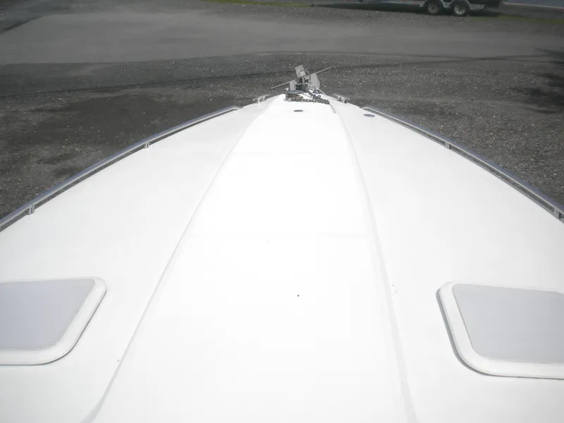 Slide: The Image of Bow view of 2002 Formula 330 SS boat on land. - 4