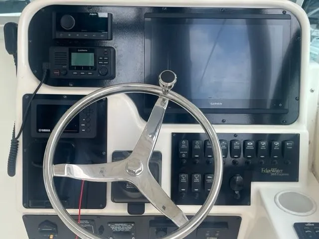 Slide: The Image of Steering console of 2008 Edgewater 265 Express boat with Garmin electronics. - 13