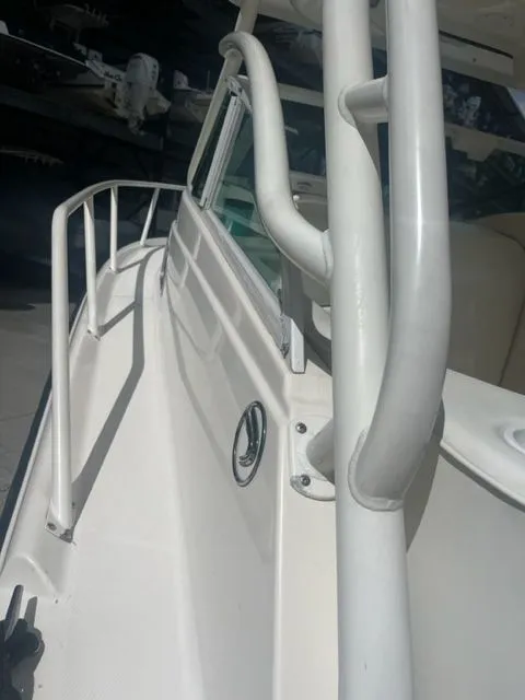 Slide: The Image of 2008 Edgewater 265 Express boat deck with railing and cabin view. - 15
