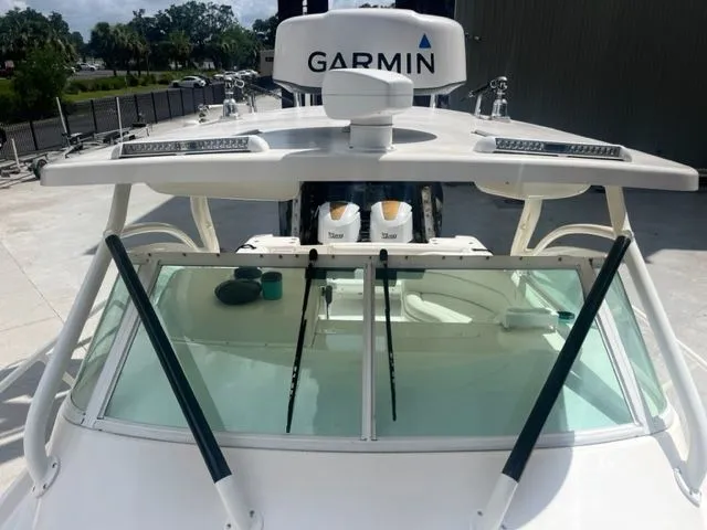 Slide: The Image of 2008 Edgewater 265 Express boat with Garmin radar, docked outdoors. - 19