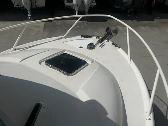 Slide: The Image of Bow of 2008 Edgewater 265 Express boat with hatch and railing. - 20