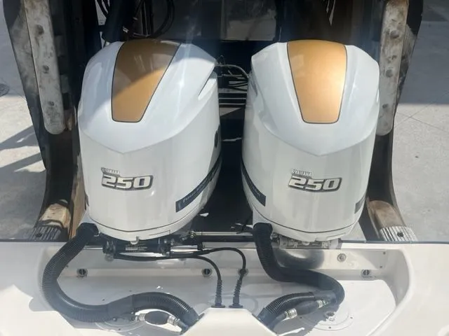 Slide: The Image of Twin Yamaha 250 outboard engines on a 2008 Edgewater 265 Express boat. - 4