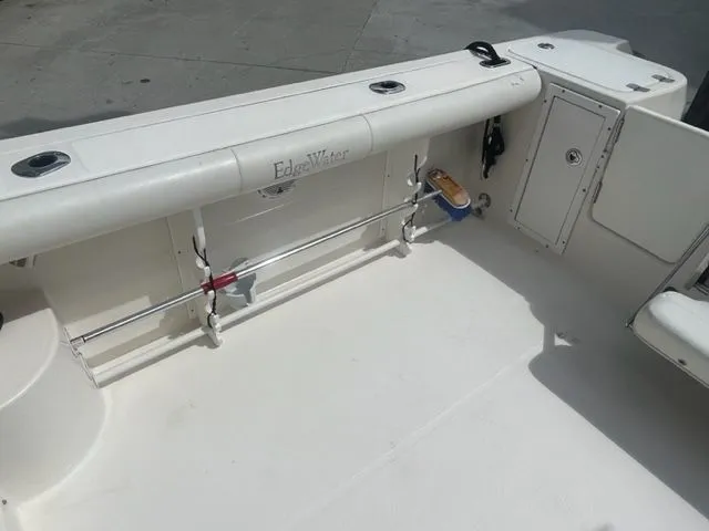 Slide: The Image of 2008 Edgewater 265 Express boat interior with rod holders and storage compartments. - 7