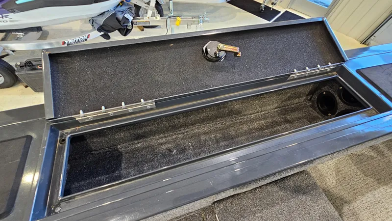 Slide: The Image of Open storage compartment in 2021 Tracker Targa V-18 Combo boat. - 23