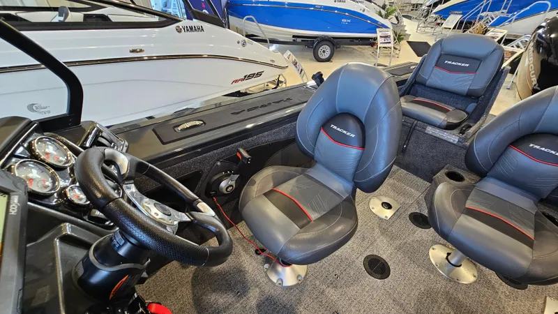 Slide: The Image of Interior of 2021 Tracker Targa V-18 Combo boat with steering wheel and seating. - 9