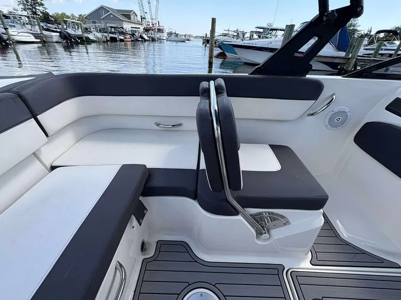Slide: The Image of 2019 Bayliner VR6 boat interior with sleek seating and waterfront view. - 13