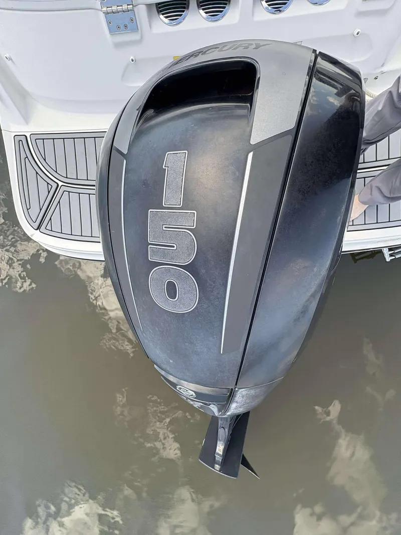 Slide: The Image of 2019 Bayliner VR6 with Mercury 150 outboard motor on water. - 15