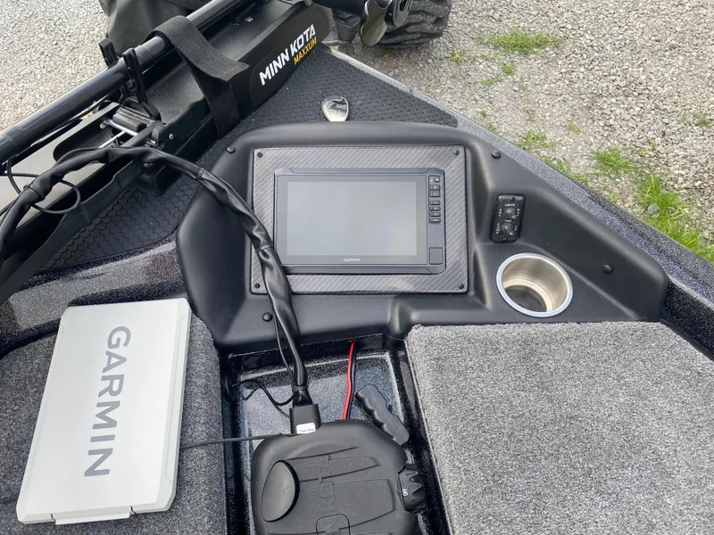 Slide: The Image of Dashboard of 2025 Phoenix 818 Pro boat with Garmin electronics and Minn Kota trolling motor. - 11