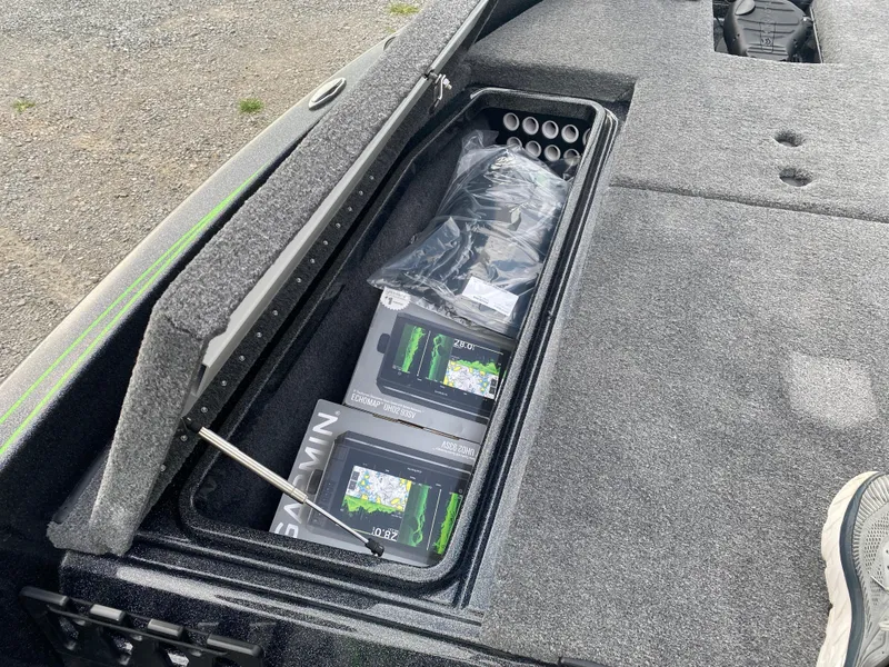 Slide: The Image of Storage compartment in a 2025 Phoenix 818 Pro boat with Garmin electronics. - 12