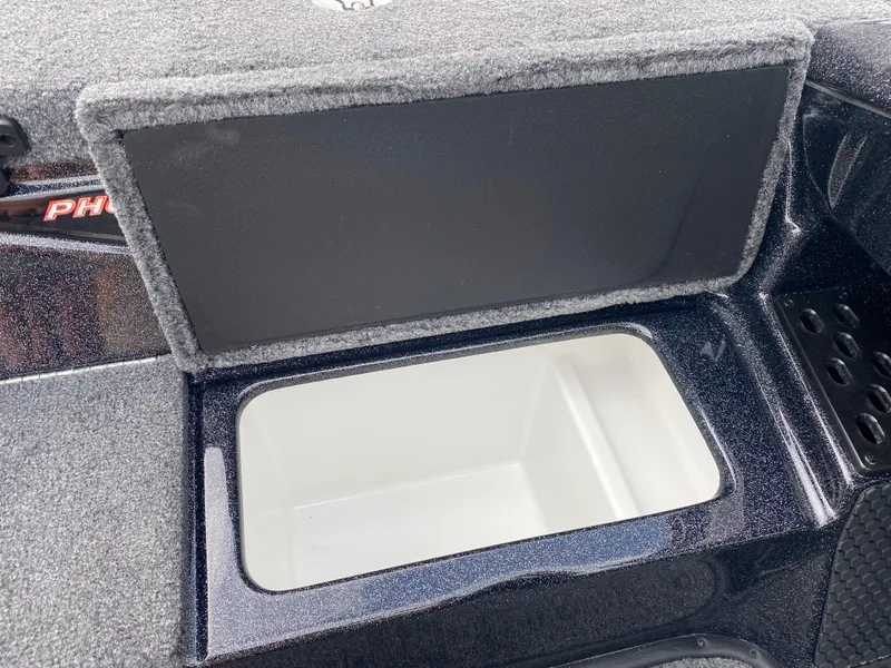 Slide: The Image of Open storage compartment in 2025 Phoenix 818 Pro boat, featuring a sleek interior design. - 15