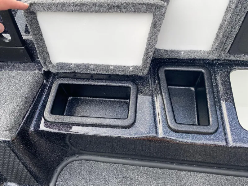 Slide: The Image of 2025 Phoenix 818 Pro boat storage compartments with open lids, showcasing interior design. - 16