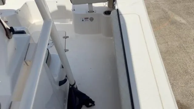 Slide: The Image of 2022 Carolina Skiff 26 Ultra Elite boat interior, featuring seating and storage areas. - 18