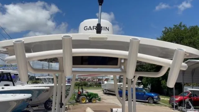 Slide: The Image of 2022 Carolina Skiff 26 Ultra Elite boat with Garmin equipment, docked outdoors. - 19