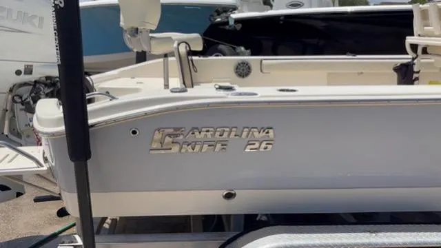 Slide: The Image of 2022 Carolina Skiff 26 Ultra Elite boat on trailer, side view. - 21